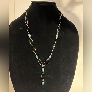 Handmade necklace with silver hoops and turquoise beads